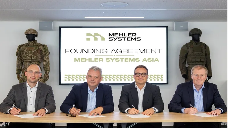 Vertreter von Mehler Systems unterzeichnen die Gründungsvereinbarung für Mehler Systems Asia vor Schaufensterpuppen mit ballistischer Schutzausrüstung