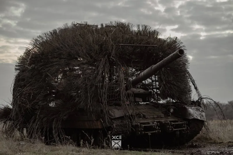 A captured T-80BVM operated by the Ukrainian Army, fitted with extensive 'hedgehog tank' type improvised armour to protect against drones.