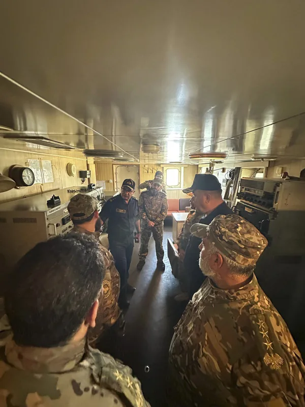 Turkish navy officials in discussion with their Syrian counterparts during their visit to the Syrian port city of Latakia on 23 October 2026.