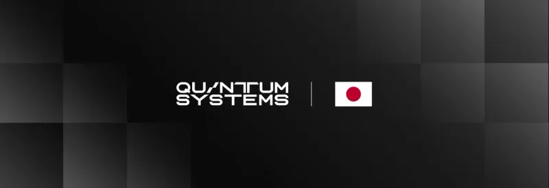 Firmenlogo von Quantum-Systems neben der japanischen Nationalflagge auf dunklem Hintergrund
